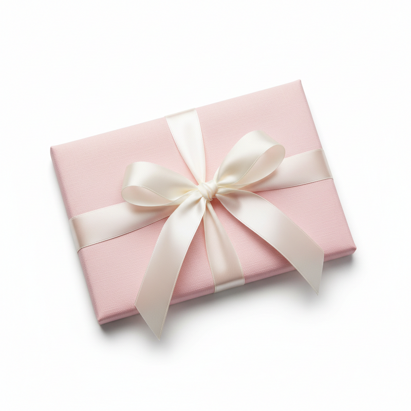 Pink gift box with a white ribbon on a white background